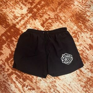 Strawberry Milk Mob swim shorts.